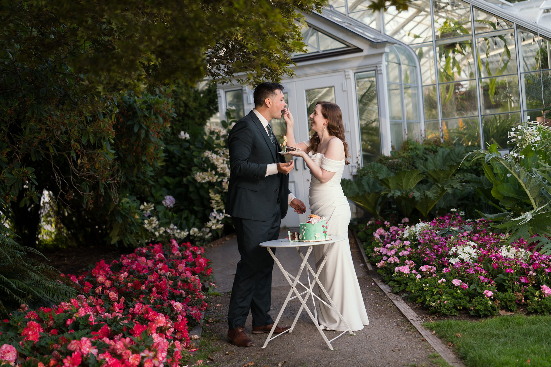 Couple cutting cake at Volunteer Park Conservatory in Seattle