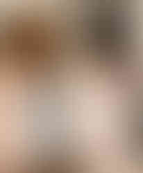 Bride and three bridesmaids in pastel dresses preparing for wedding.