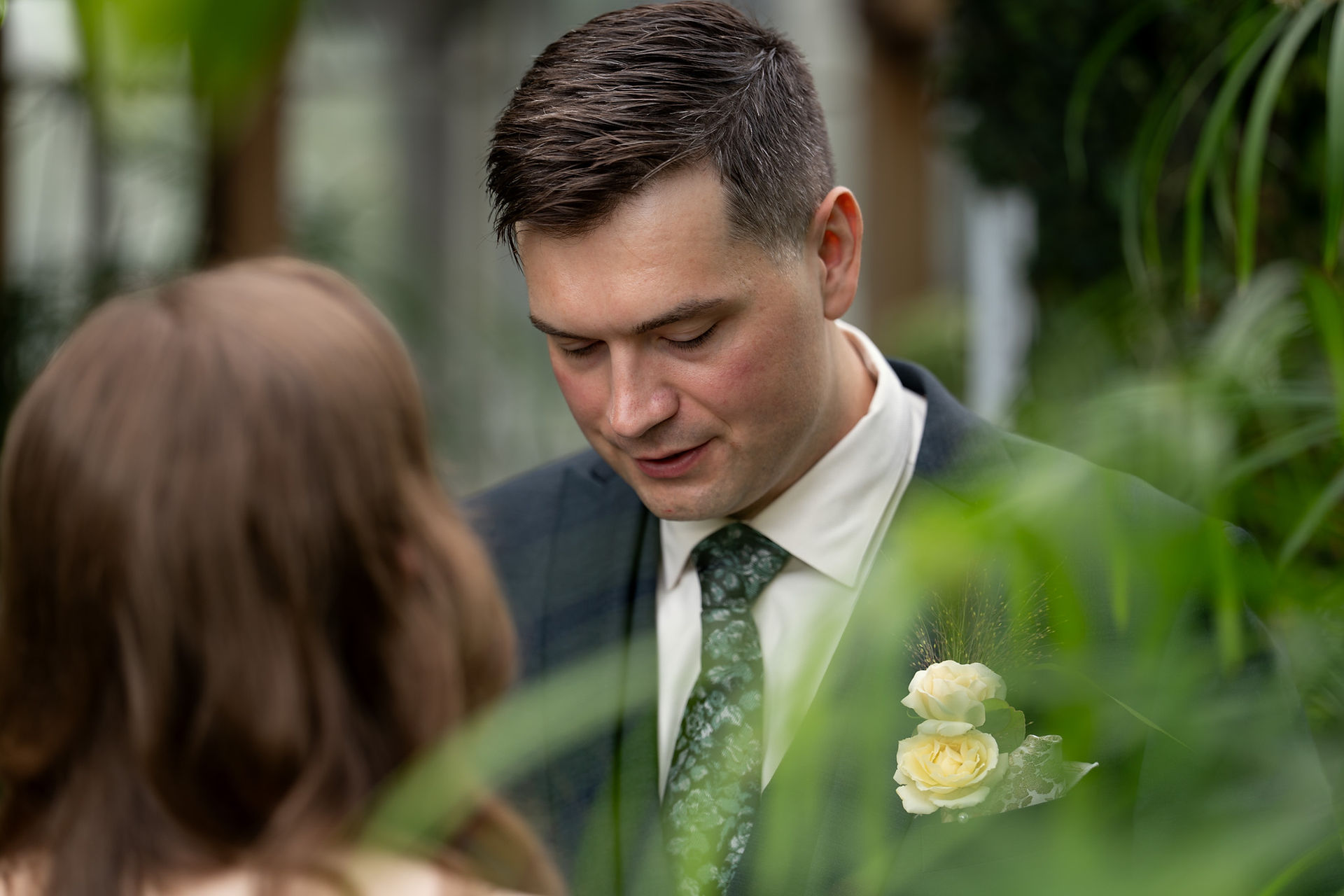 Groom reading vows at Volunteer Park Conservatory in Seattle