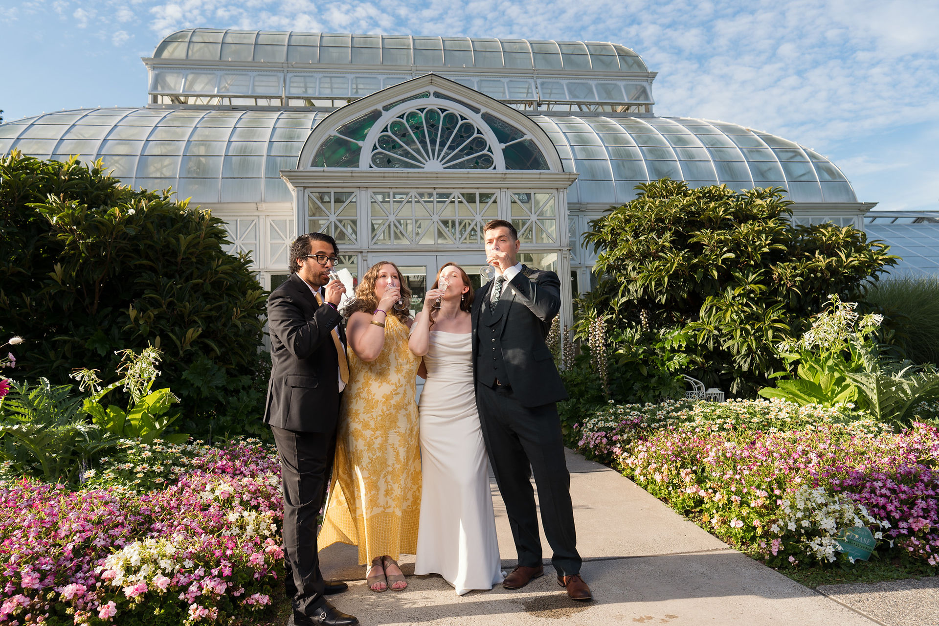 A wedding party at Volunteer Park Conservatory in Seattle.