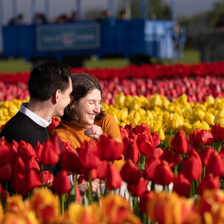 Smiling couple in tulips at Skagit Tulip Festival