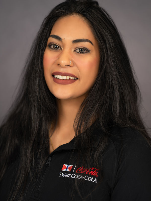 Headshot: Smiling woman in black shirt