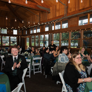 Guests celebrating at a Gold Mountain Golf Club wedding reception.