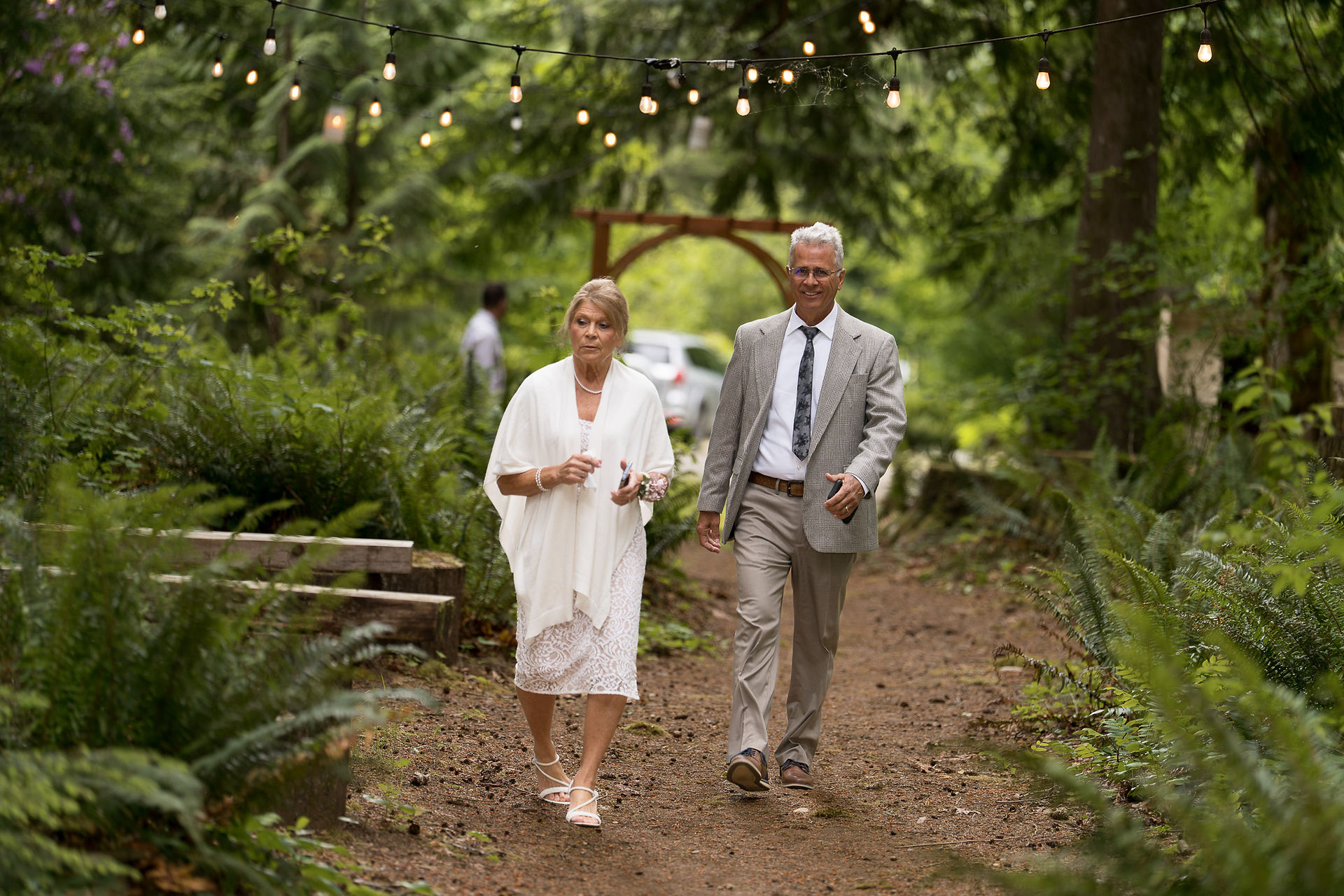 Wedding guests walk a trail at Forest Creek Darrington WA