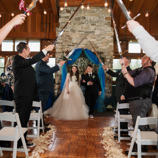 Gold Mountain Golf Club wedding couple under sword arch