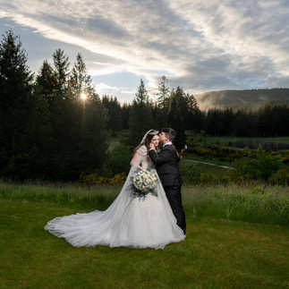 Bride and groom kiss at Gold Mountain Golf Club wedding.