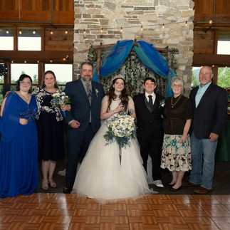 Wedding couple with family at Gold Mountain Golf Club