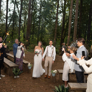 Newlyweds walk through sparklers at Forest Creek Darrington WA
