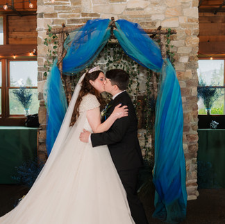 Bride and groom kiss at Gold Mountain Golf Club wedding