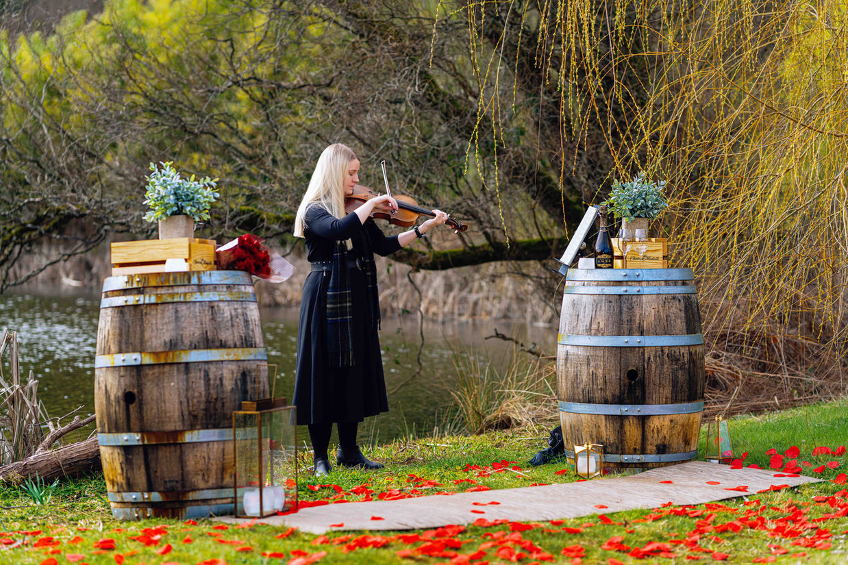 Violinist playing at outdoor ceremony