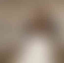 Couple dancing intimately at their wedding reception under tent lights.