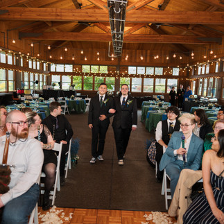 Grooms walking down aisle at Gold Mountain Golf Club wedding.