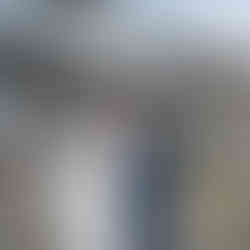 Bride and groom kissing outdoors at a beautiful white farmhouse, Intimate Farm Wedding.