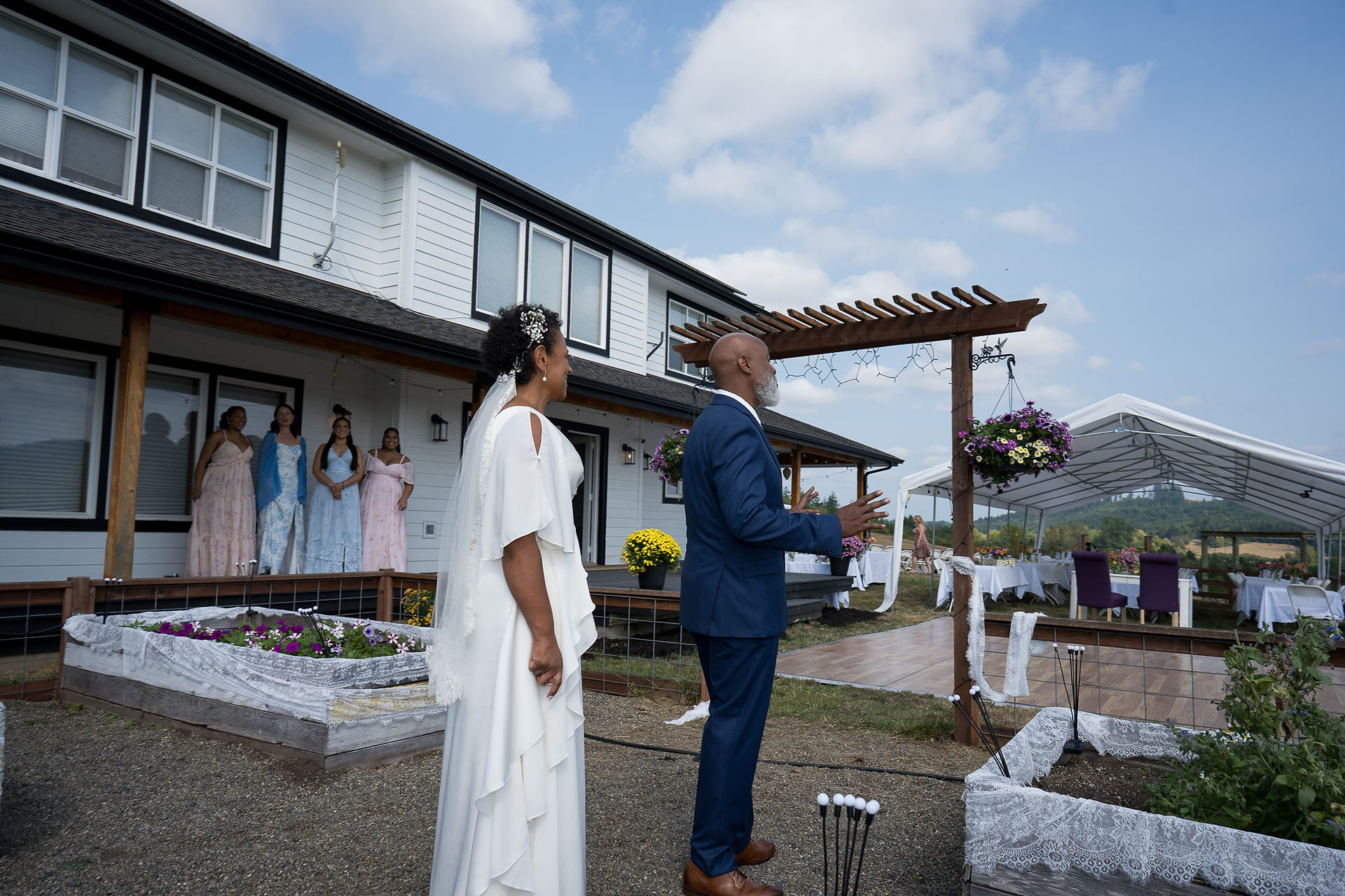 Bride and groom at their intimate outdoor farm wedding ceremony.