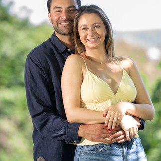 Happy couple embraces outdoors