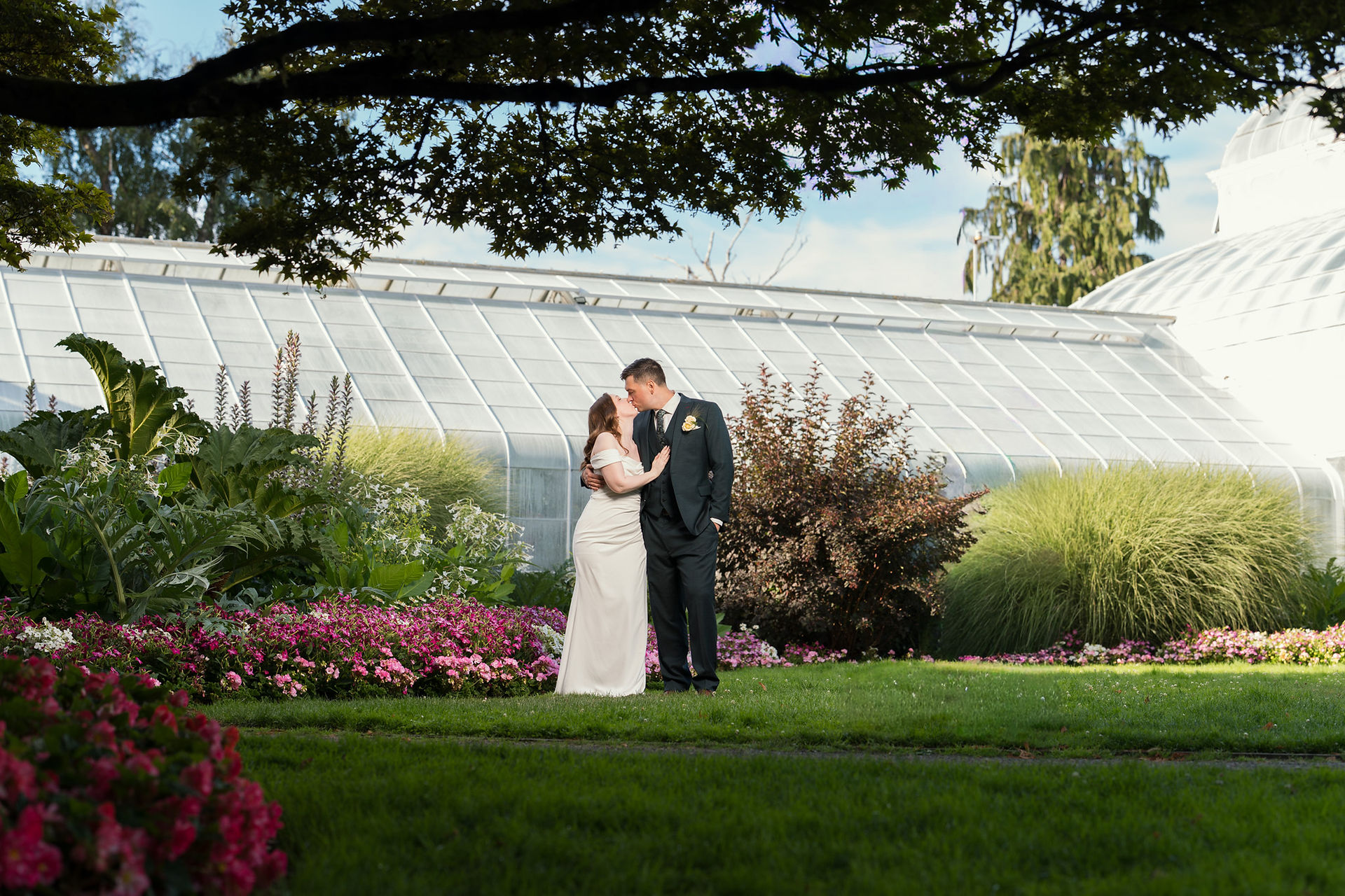 Couple kissing at Volunteer Park Conservatory in Seattle