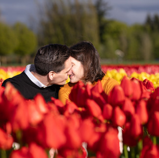 Engaged couple embracing at Skagit Tulip Festival