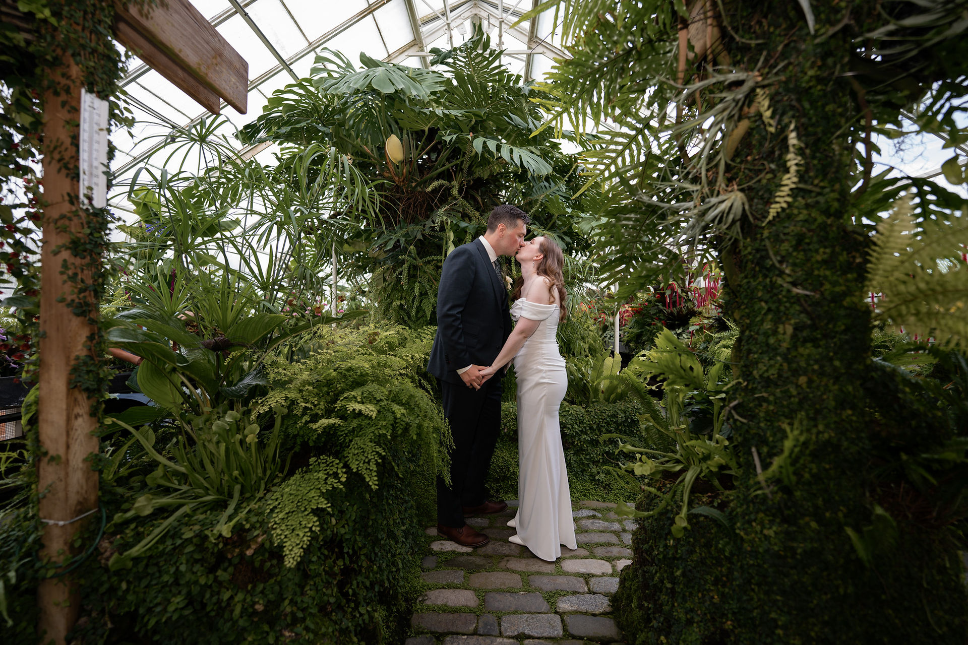 Couple kissing at Volunteer Park Conservatory in Seattle