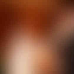 Bride exchanging vows with groom and officiant during Bastyr Chapel Wedding.