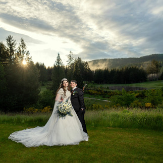 Bride and groom at Gold Mountain Golf Club Weddings with sunset