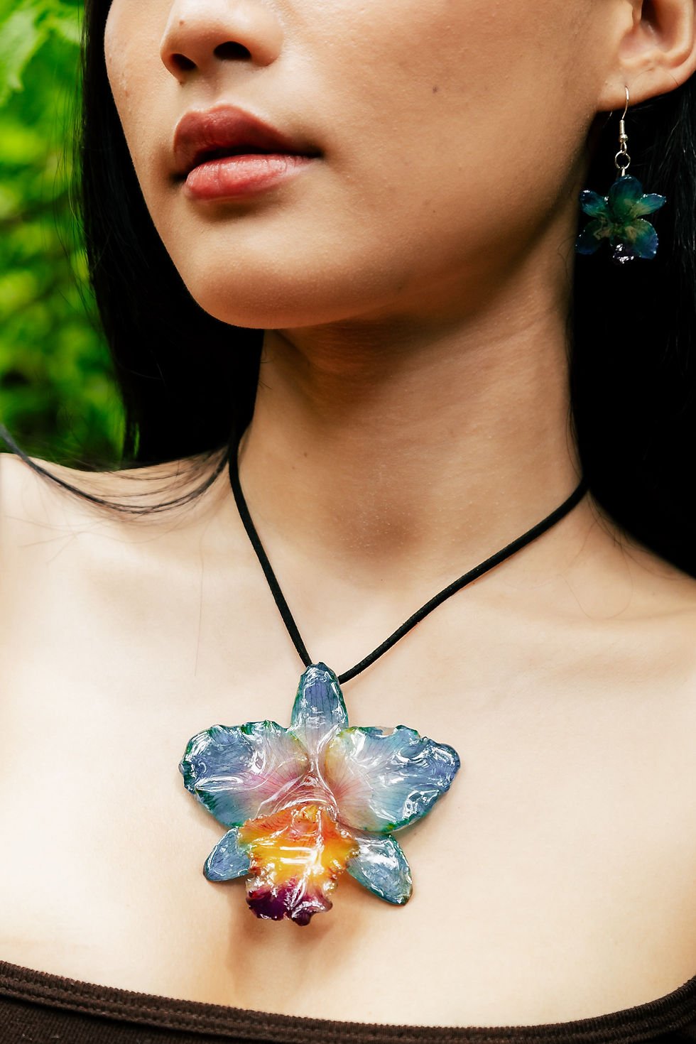 Woman wearing one of our real flower necklaces.
