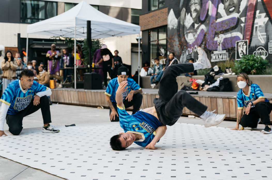 Breakdancers performing at outdoor event