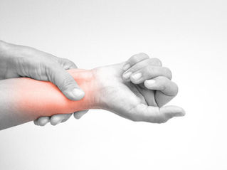 Person holding painful wrist highlighting wrist and hand pain | Jean Donati Acupuncture, Towson MD