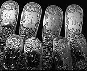 Hand engraving silver forks