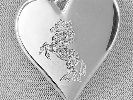 Hand-engraved Pony on the silver charm