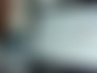 Eye-level view of a laptop screen showing website builder dashboards