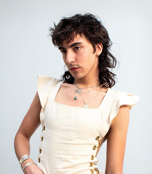 Headhot of Wylie Knight wearing a tunic made by Eden Meidl