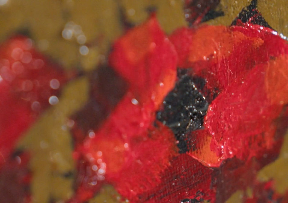 Close-up of a vibrant red poppy with a black center. The defined brushstrokes in Gordon Wilson's artwork, showcase the textured detail and rich colours characteristic of his painting style.