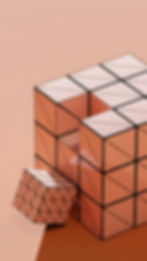 An abstract pink cube with a missing section, suggesting reflection, fit and whether something feels complete