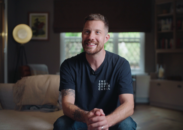Todd, a testicular cancer survivor, sitting in a chair and sharing his story in a video for Cahonas charity, raising awareness for testicular cancer.