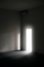 An open doorway filled with bright white light, symbolising clarity, confidence and new possibilities