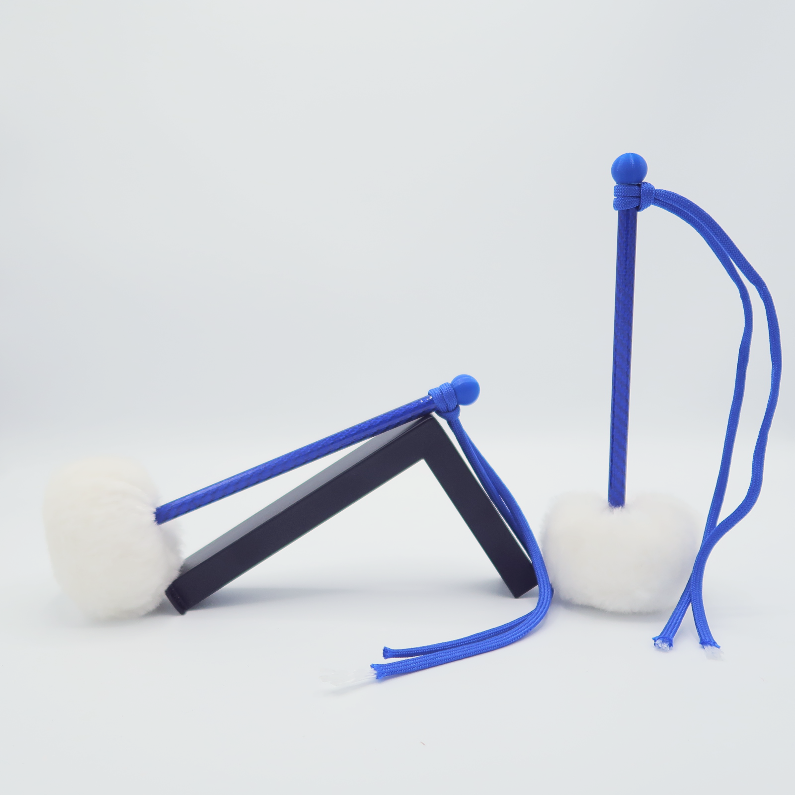 By the right: Tenor Sticks (White x Blue)