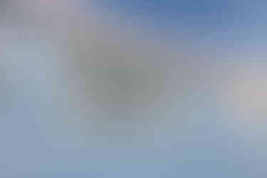 a banner on the side of a greenhouse reads We build regenerative systems which empower others to create a healthy and abundant world.