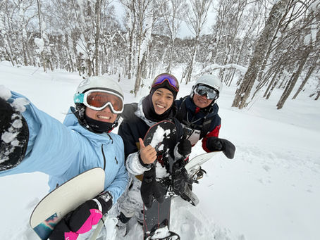 Group photo of students and their instructor smiling together.