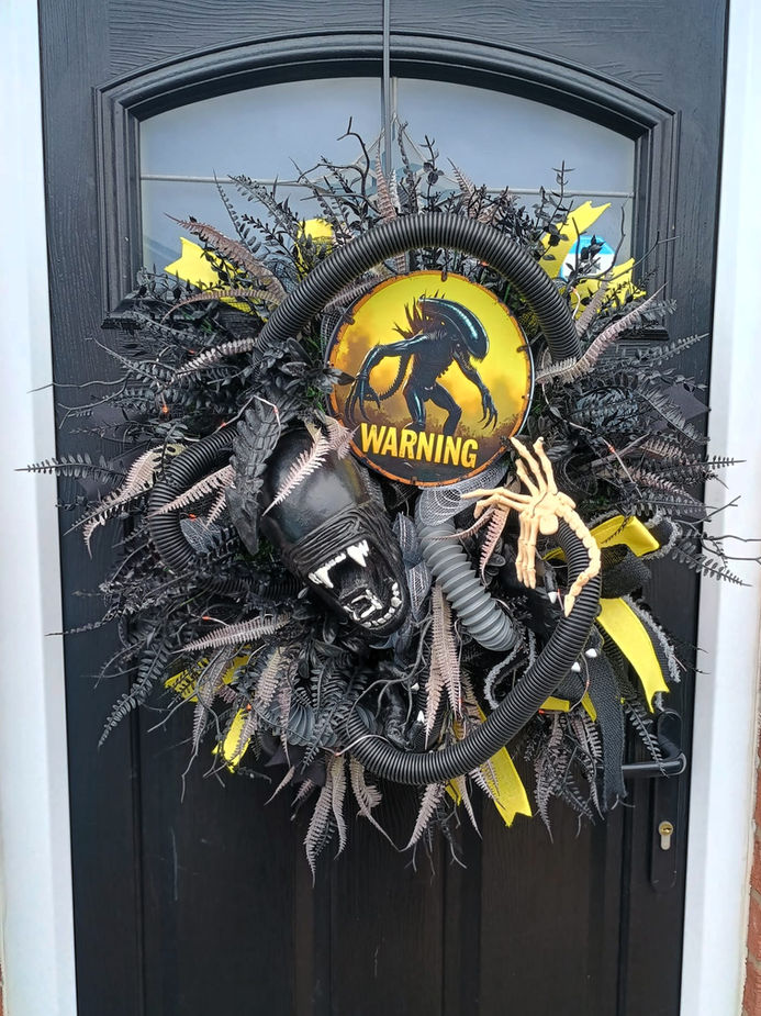 Light up alien monster Halloween door wreath with 3D alien figure and warning sign - front view