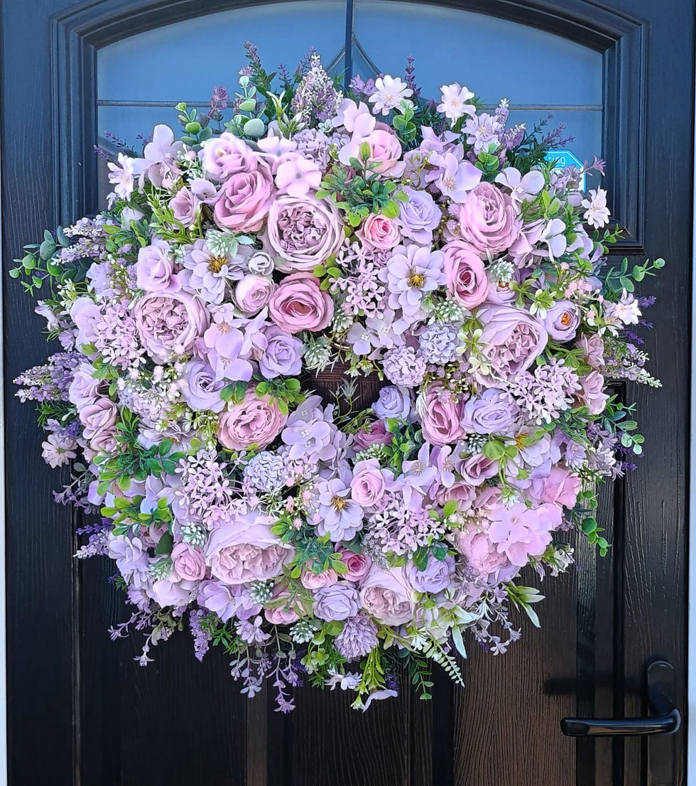 Artificial Purple Rose & Lilac wreath gift displayed on a black door -