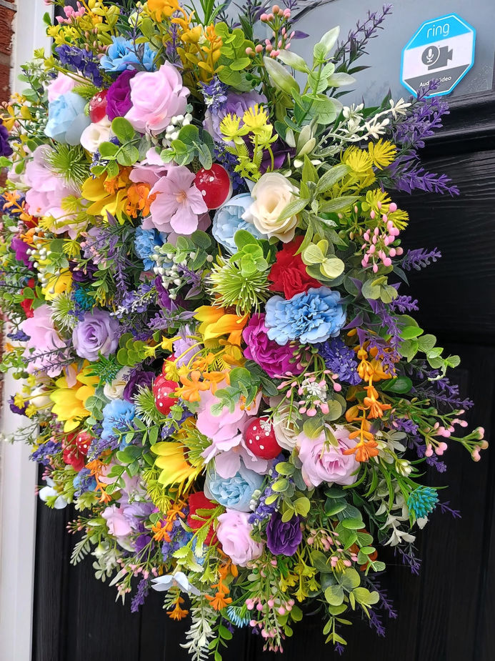 Handmade rainbow door wreath hung on front door magical display handmade UK