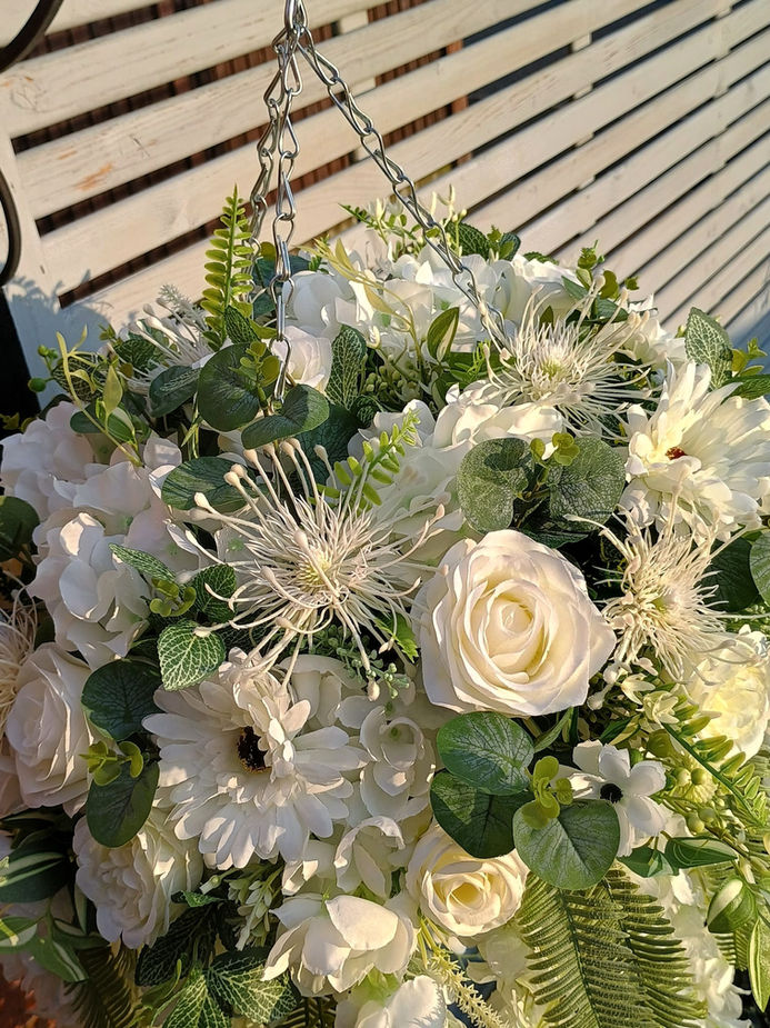 Luxury XL artificial ivory flower arrangement in a cone‑shaped wicker hanging basket, featuring full blooms and natural green