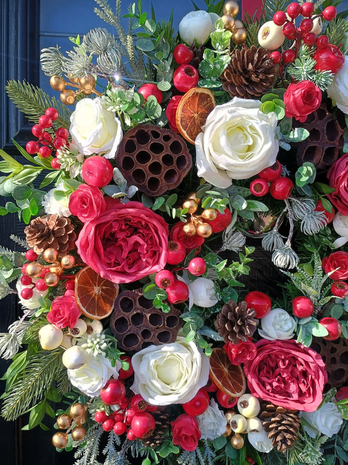Handmade luxury winter rose artificial door wreath with red cream roses and pine cones - Close Up