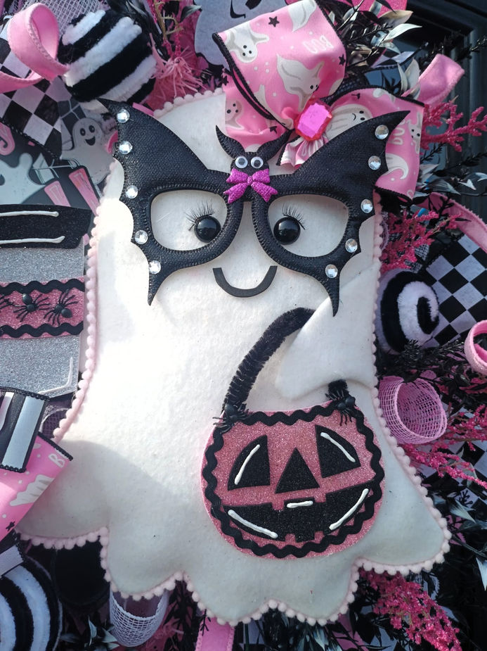 Close up of handmade ghost with coffee cup and pumpkin on Halloween cute ghost wreath UK