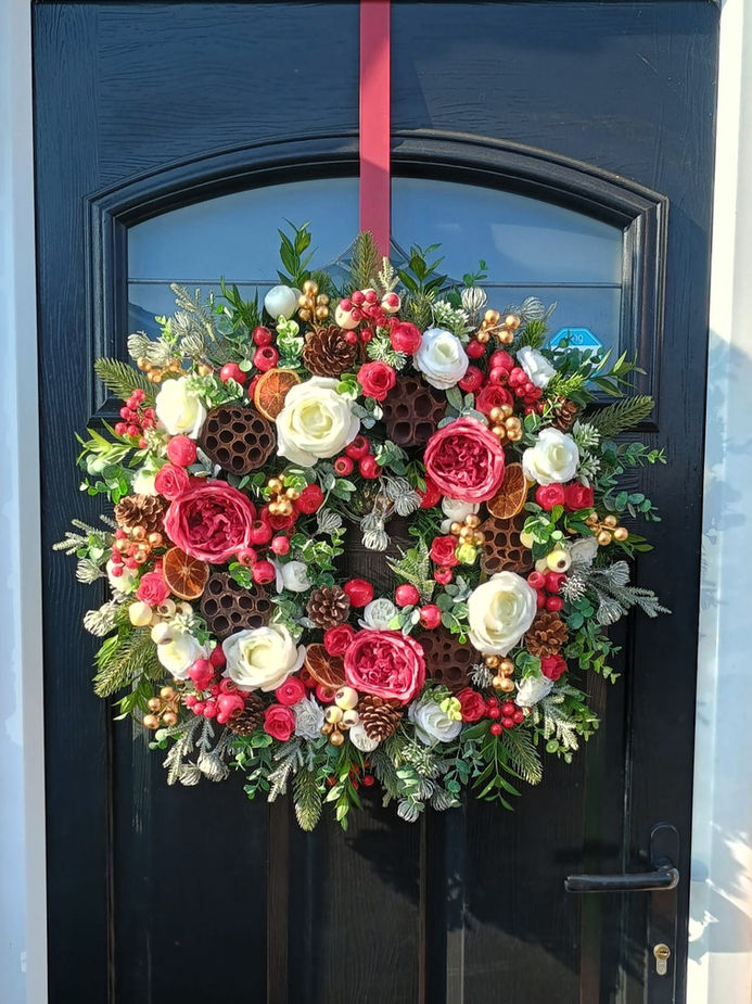 Handmade luxury winter rose artificial door wreath with red cream roses and pine cones - front view