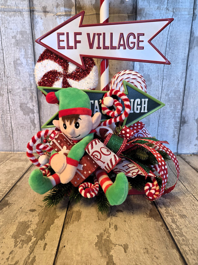 Close up of XL North Pole sign post and letter holder Christmas centrepiece