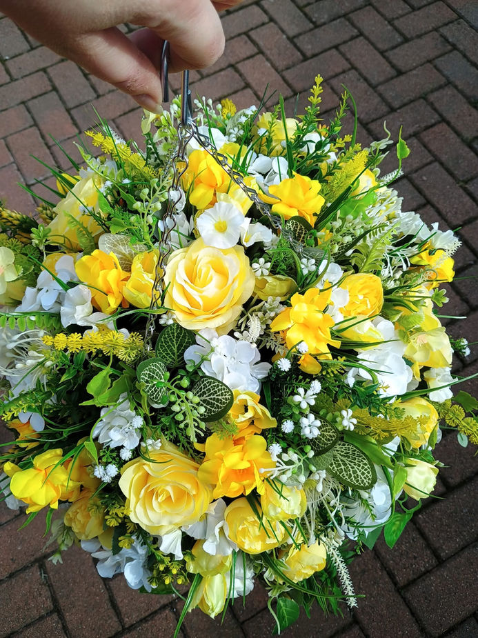 Handcrafted yellow and ivory artificial flower hanging basket featuring realistic blooms and premium faux foliage