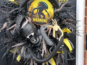 Halloween door wreath featuring an alien 