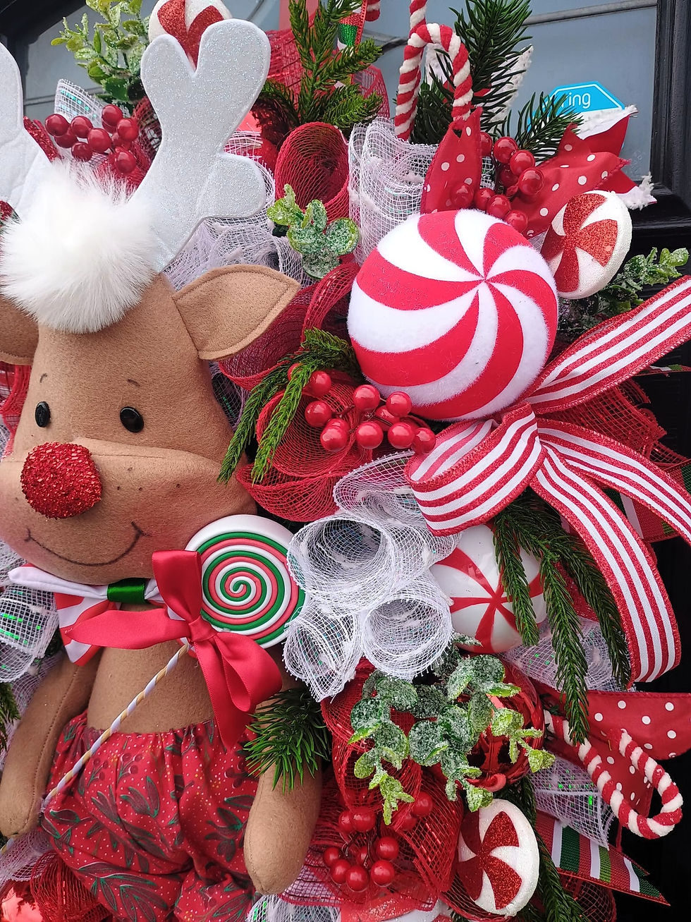 Thumbnail: Festive Christmas wreath with reindeer, candy canes, and holiday decorations on a door