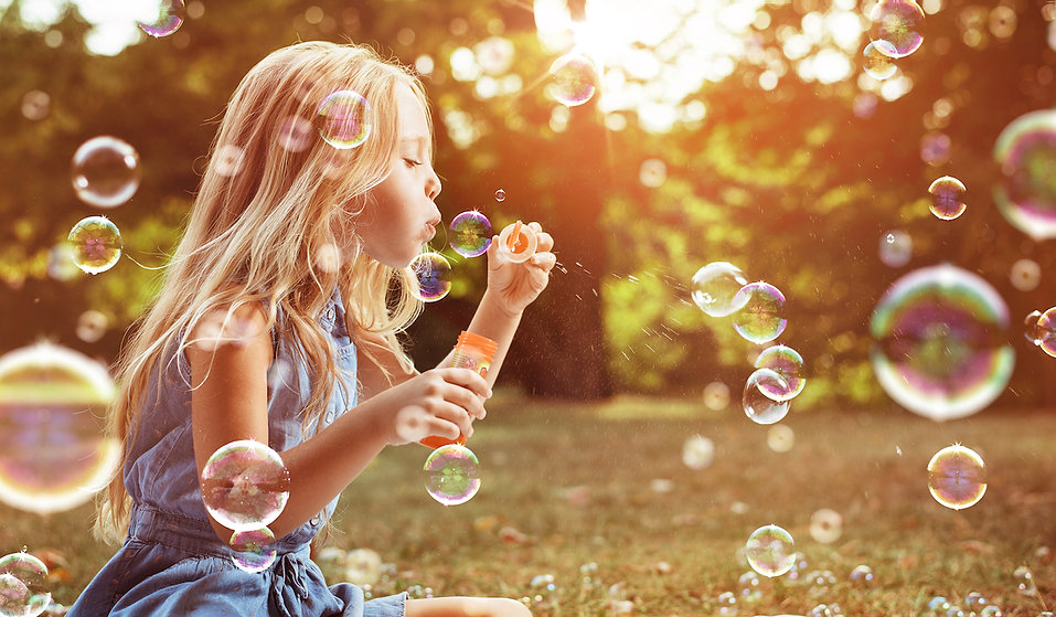 young-girl-blowing-bubbles.jpeg